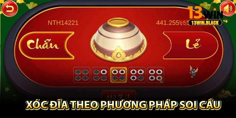 Giao diện livestream trò chơi xóc đĩa tại 13win với dealer thật và đồng xu đỏ trắng rõ nét